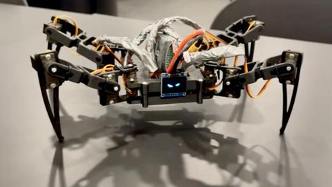 Bach's NYX-V quadruped robot with its printed frame, motors, and electronics.